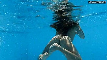 Hey, check out this beautiful big-breasted Hungarian beauty Angelica Heart by the pool! 🌊👙