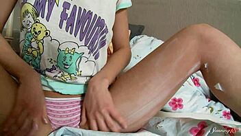 slim brunette calla oils up her body in lingerie, fingering her wet shaved pussy solo with a dildo