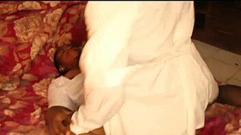 Nigerian nurse handles her patient during a steamy night shift at the hospital.