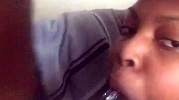 Massive black cock received eager sucking from aroused partner in intimate encounter