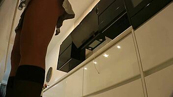 Are those big boobs on that hot blonde housewife in the kitchen without panties?