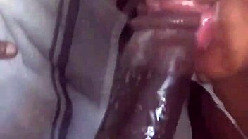 Massive black cock received eager sucking from aroused partner in intimate encounter