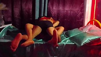 this cute mexican brunette in a sexy dress teases her friend with legs spread in homemade bedroom roleplay for christmas fun.