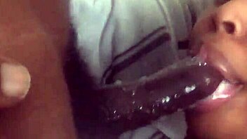 Massive black cock received eager sucking from aroused partner in intimate encounter