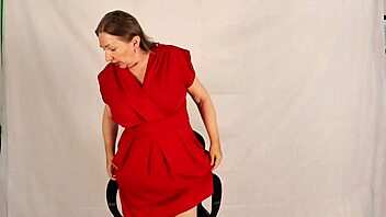 Busty giantess granny towers over tiny guy, playing with her huge natural tits in taboo homemade fun during old and young encounter.