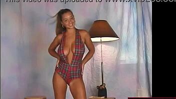 Check out this busty teen in a sexy slingshot dress dancing wildly