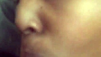 Massive black cock received eager sucking from aroused partner in intimate encounter