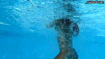 Hey, check out this beautiful big-breasted Hungarian beauty Angelica Heart by the pool! 🌊👙