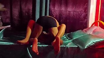 this cute mexican brunette in a sexy dress teases her friend with legs spread in homemade bedroom roleplay for christmas fun.