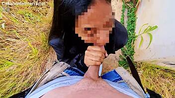 We pulled over at an abandoned building on the road where she eagerly sucked my cock in public excitement.