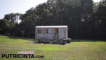 Asian babe Putri Cinta spreading legs to reveal shaved pussy