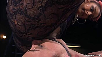 Shackled ebony bound with legs up in the air for kinky domination