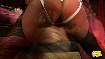 A sexy blonde and a stunning brunette ride strapon toy in passionate lesbian licking session.