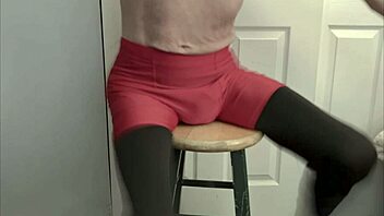 Grinding On Stool In Black Compression Tights And Red Compression Shorts For Intense Leg And Ass Workout Display