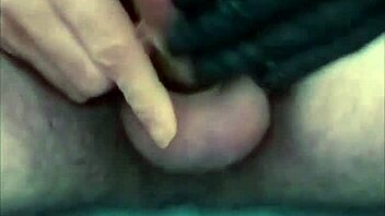 guy strokes cock hard with latex gloves and ring on