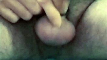 guy strokes cock hard with latex gloves and ring on