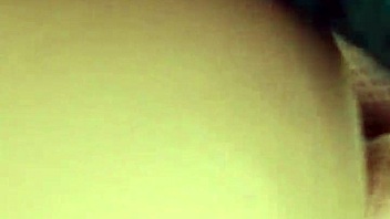 latina slips toy into ass during intimate play session