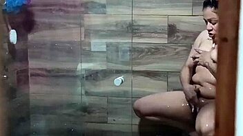 Spying on sexy latina milf shaving and masturbating before shower