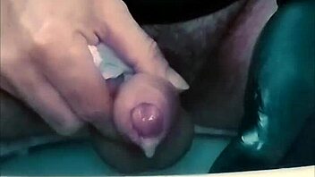 guy strokes cock hard with latex gloves and ring on