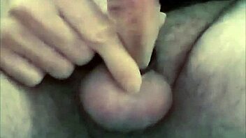 guy strokes cock hard with latex gloves and ring on