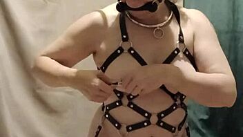 bound milf maid chained in harness submits to dildo humiliation