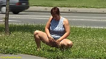 Redhead bbw milf unleashes public outdoor golden shower fetish