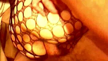 Sexy girl flaunts ass in fishnet lingerie and thong