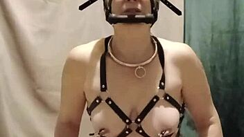 bound milf maid chained in harness submits to dildo humiliation