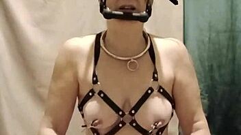 bound milf maid chained in harness submits to dildo humiliation