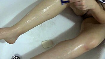 milf shows off nice ass and shaves pussy in shower uh nice