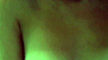 Grace relaxes on the bed with her favorite toy