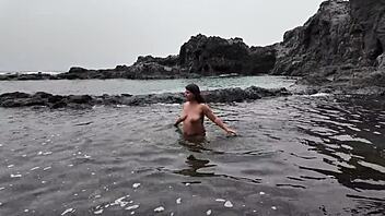 a busty euro milf sucks candy on beach then real cock