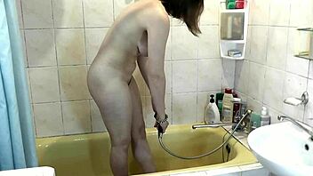 Blonde milf helps brunette masturbate wet pussy in steamy shower tease!