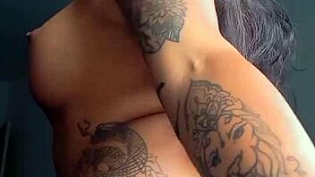 Tattooed Prostitute Flaunts Tight Ass Closeup