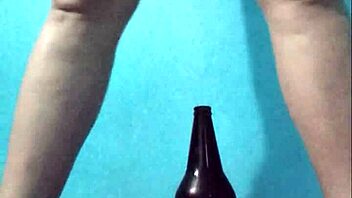 Curvy latina masturbates richly with bottle on pussy