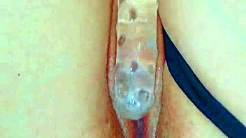 watch her puffy shaved pussy devour that glass dildo sensually