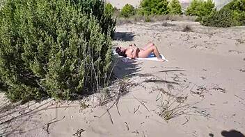 stranger eyes milf's hairy pussy on nudist beach ready for public flashing and outdoor sex?
