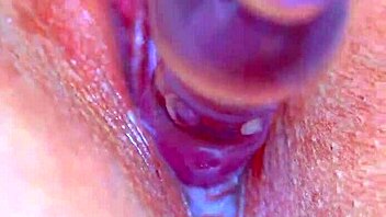 watch her puffy shaved pussy devour that glass dildo sensually