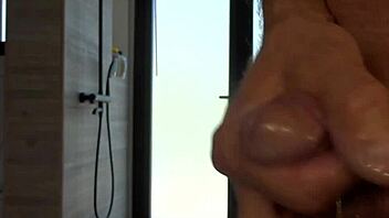 guy plays with his small oiled cock during masturbation session