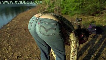 Curvy mature brunette flashes big ass thong at beach lake