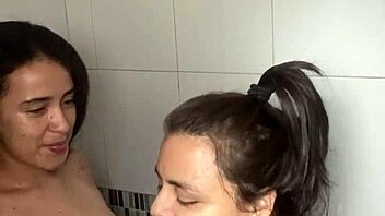 Two Bathing Beauties Lick and Film Steamy Lesbian Shower