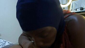 Ebonyski mask slut deepthroats big black cock and swallows cum