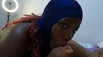 Ebonyski mask slut deepthroats big black cock and swallows cum