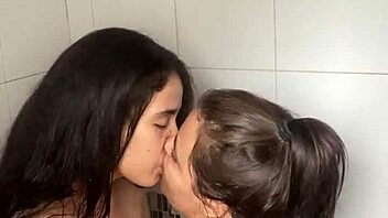 Two Bathing Beauties Lick and Film Steamy Lesbian Shower