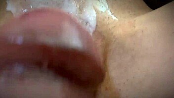 closeup rub of cumshot dripping from smooth shaved pussy lips