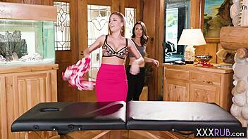 Brunette milf massages sexy lesbian's big tits