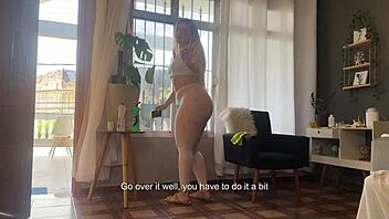 cleaning window in see-through pants revealing sexy ass