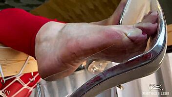 bare feet dangle clear high heels closeup