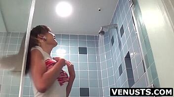 Venus Luxx strokes big cock shower solo shemale explosion