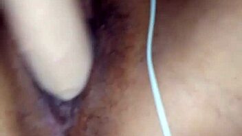 Pornstar Poosoo slides huge dildo deep into her pussy